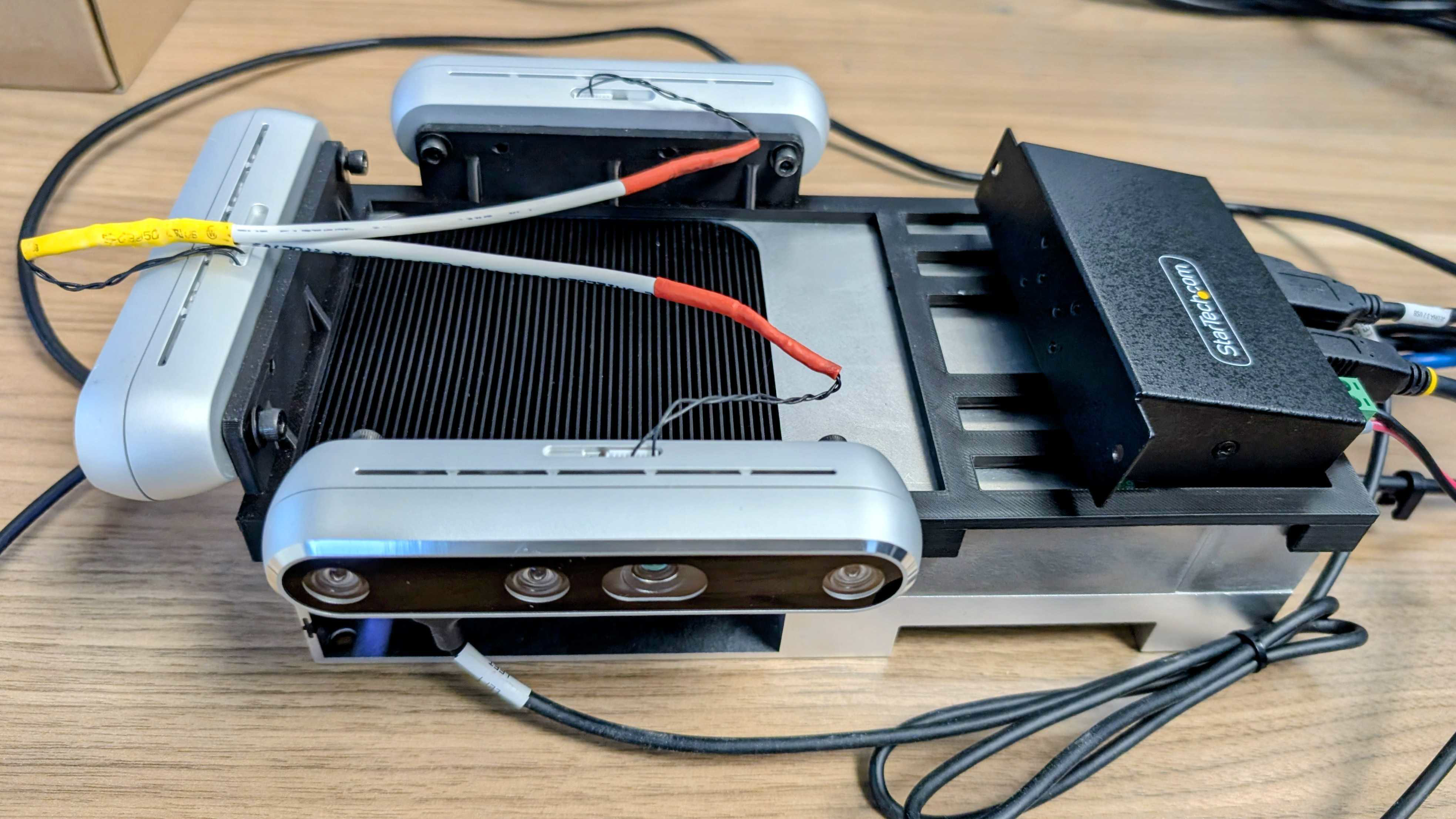 https://media.githubusercontent.com/media/NVIDIA-ISAAC-ROS/.github/release-4.6/resources/isaac_ros_docs/robots/multi_realsense_assembly_guide/thor_assembly_3rs.png/