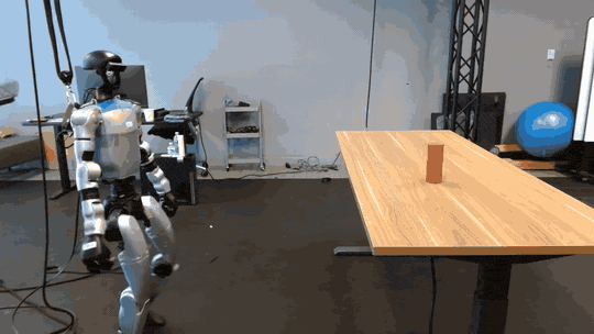 A Unitree G1 humanoid approaching a table to pick up an object