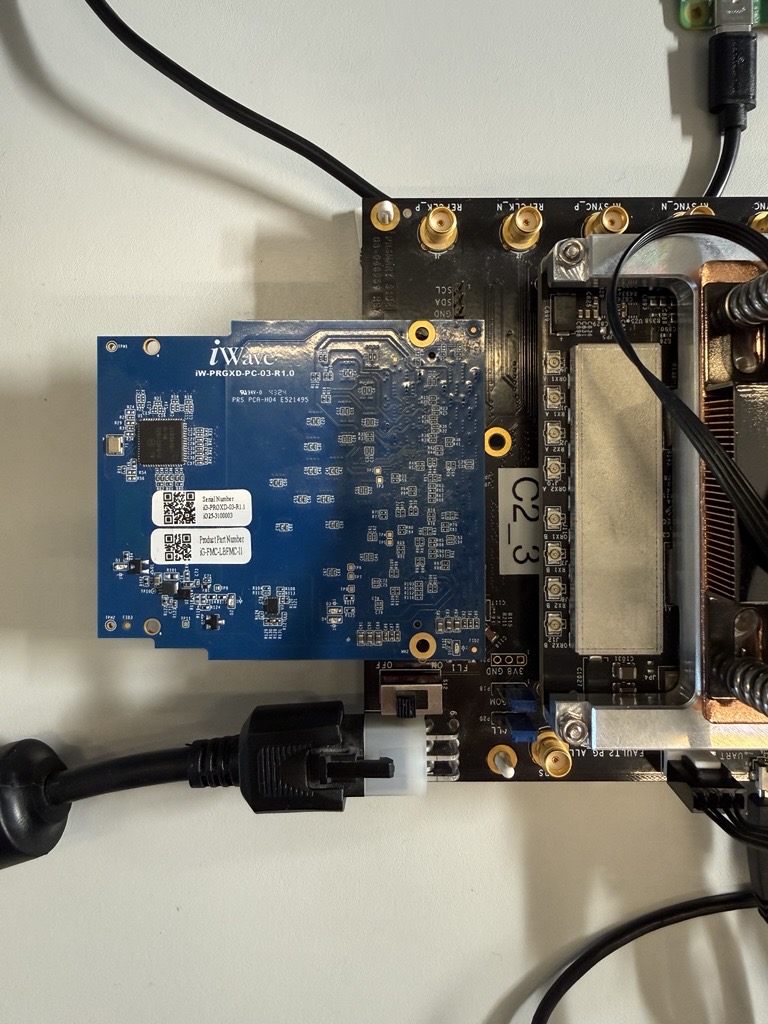 https://media.githubusercontent.com/media/analogdevicesinc/documentation/main/docs/solutions/reference-designs/eval-adrv9009/production-testing/images/fmc_loopback_connection_closeup.jpg