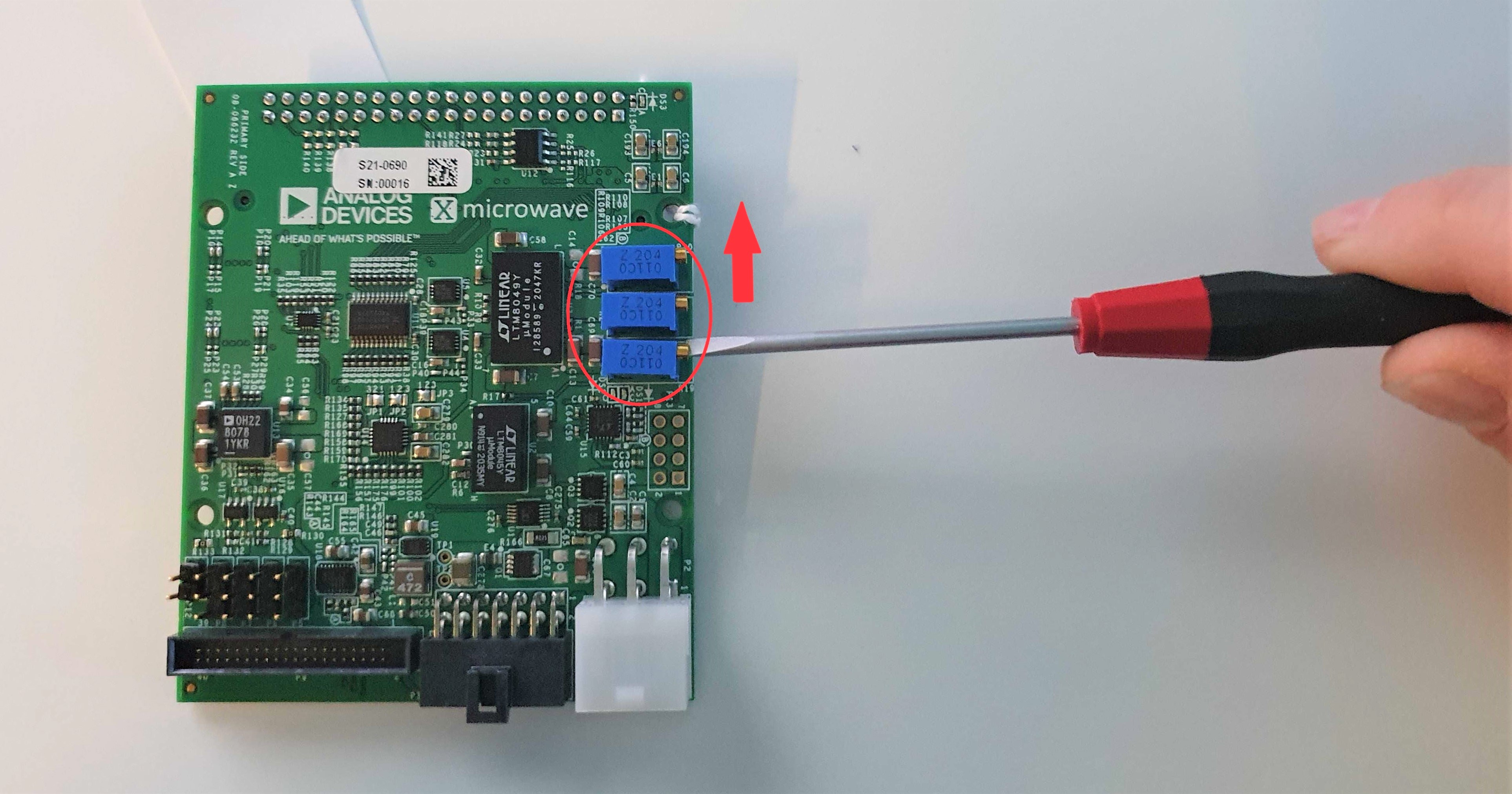 https://media.githubusercontent.com/media/analogdevicesinc/system-level/main/docs/solutions/reference-designs/ad-fmcxmwbr1-ebz/images/pot_adjustment.jpg