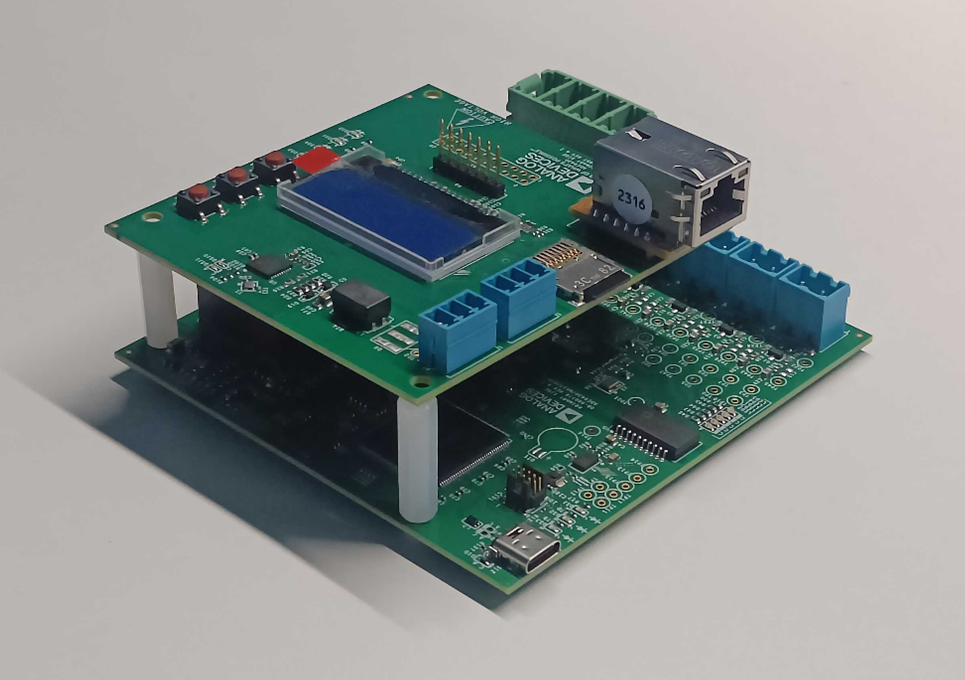 https://media.githubusercontent.com/media/analogdevicesinc/system-level/main/docs/solutions/reference-designs/ad-pqmon-sl/production_testing/images/complete_board_assembly.png