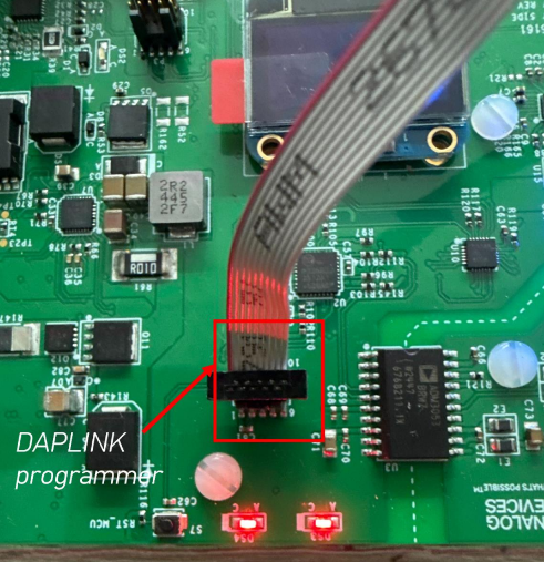 https://media.githubusercontent.com/media/analogdevicesinc/system-level/main/docs/solutions/reference-designs/adrd5161-01z/production_testing/images/daplink_programmer_connection.png