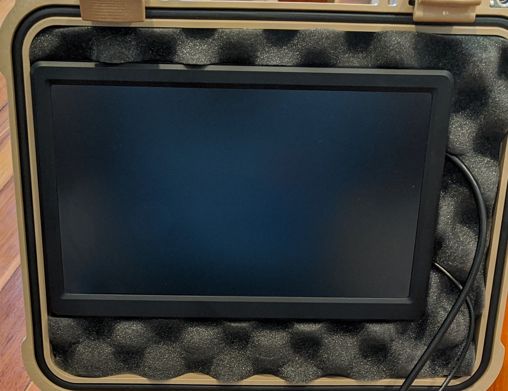 https://media.githubusercontent.com/media/analogdevicesinc/system-level/main/docs/solutions/reference-designs/cn0549/images/cn0549_pelican_case_buildup_monitor.jpg