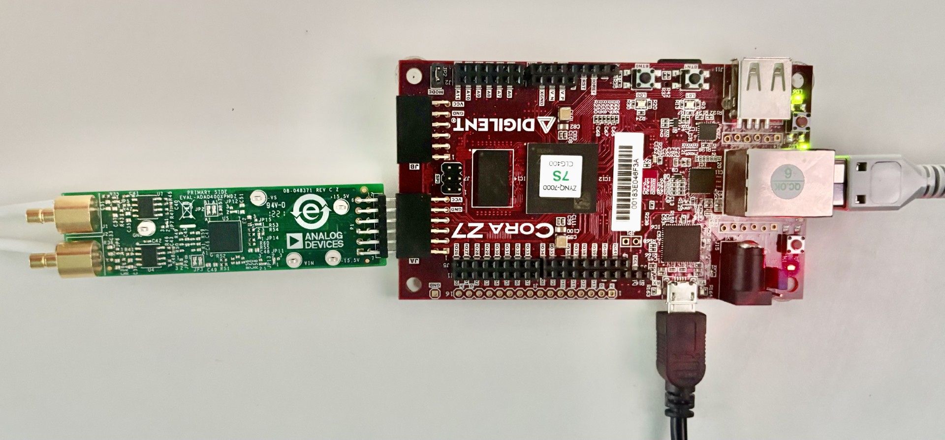 https://media.githubusercontent.com/media/analogdevicesinc/system-level/main/docs/solutions/reference-designs/pulsar_adc/images/adaq4003_coraz7s.jpg