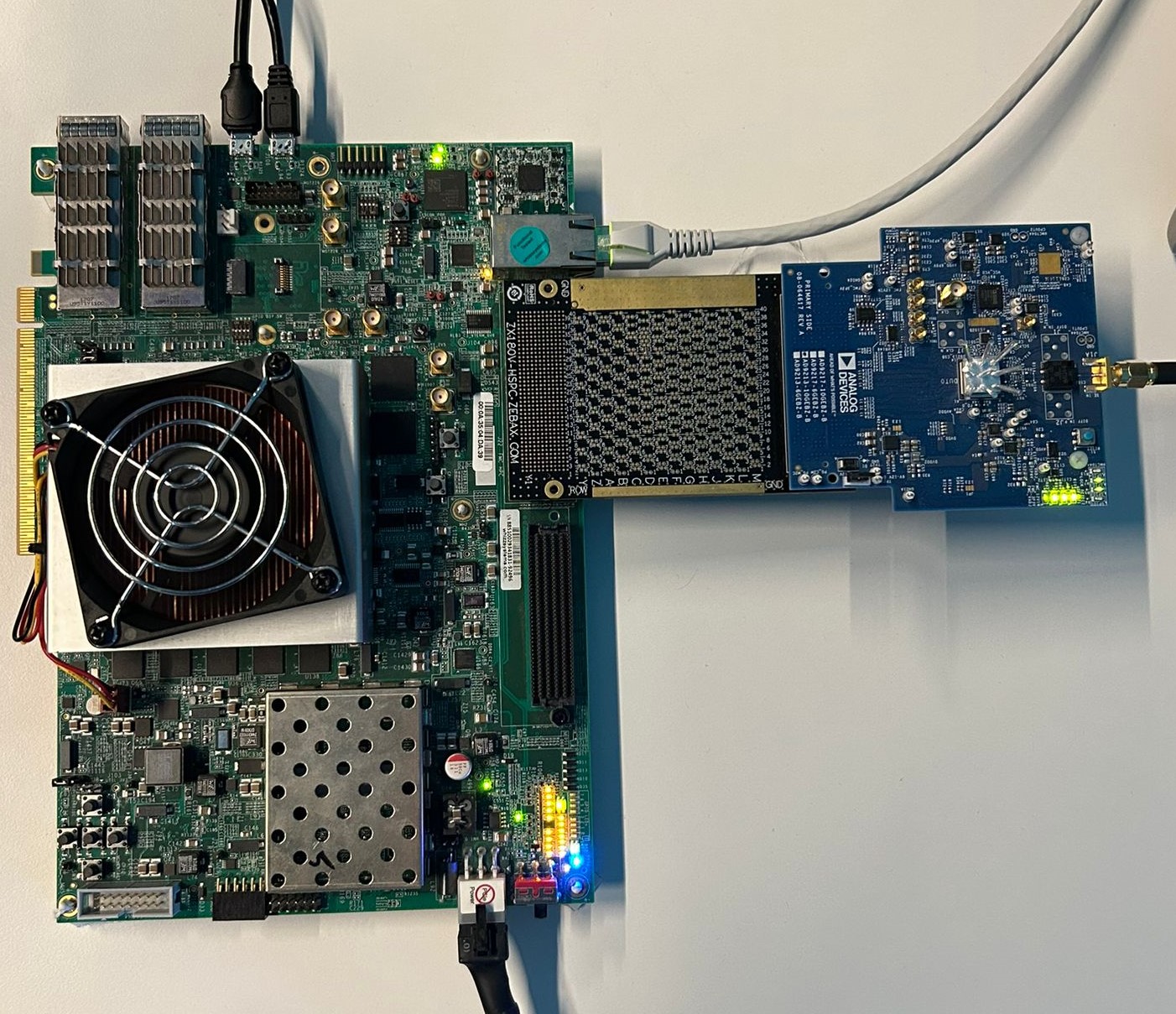 VCU118 FPGA board with EVAL-AD9213 mounted via FMC+ breakout adapter