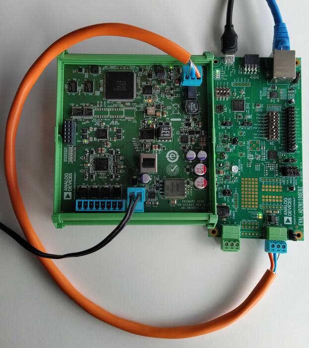 https://media.githubusercontent.com/media/plescaevelyn/adi-documentation/admv96s_prod_test/docs/solutions/reference-designs/ad-swiot1l-sl/hardware-guide/swiot1l_with_eval_adin1100.jpg