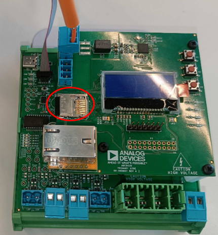 https://media.githubusercontent.com/media/plescaevelyn/adi-documentation/pqmon_prod_test/docs/solutions/reference-designs/ad-pqmon-sl/production_testing/images/sd_card_inserted.png
